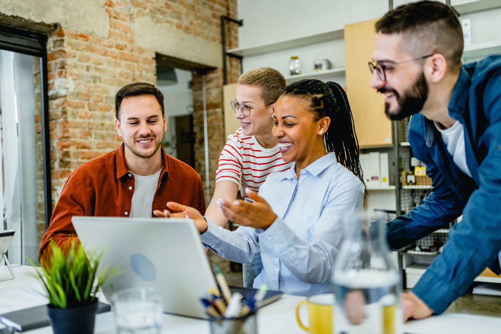 Joyful Group around computer 